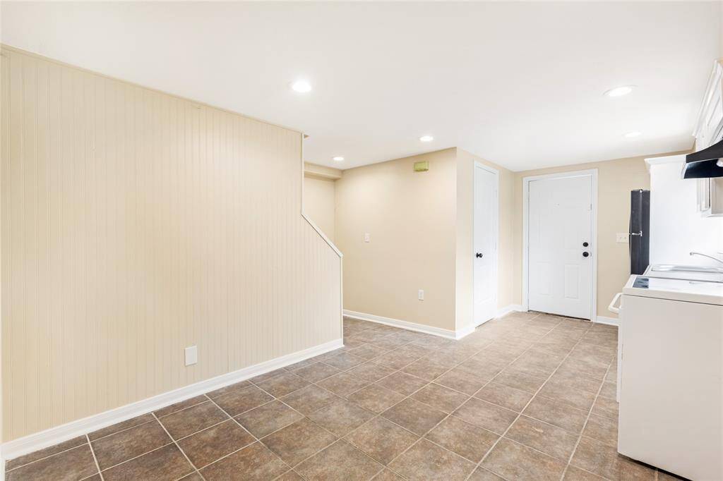 Unit 2: Cozy dining. This cheerful breakfast nook offers the perfect spot to sip your morning coffee or gather for a cozy meal. Neutral tile and recessed lighting make the space both warm and practical.