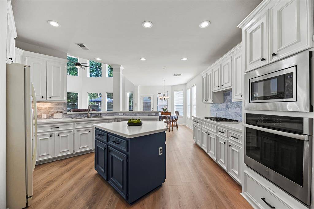 Entertaining is a breeze with an open-concept kitchen and living area. Whip up appetizers for your guests in your air-fryer or enlist their help to bake several dozen cookies for the upcoming charity bake-sale!