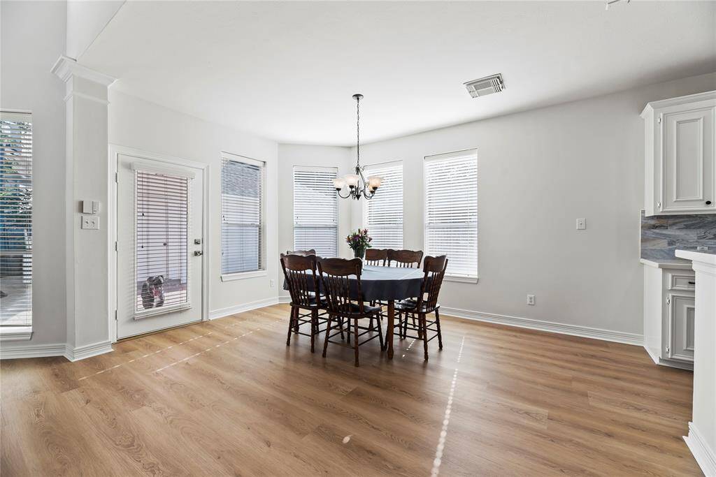 Dine in the kitchen eating area for views of the sprawling backyard! Tons of windows provide excellent sightlines and allow shimmering natural light to flood the home in luminosity.