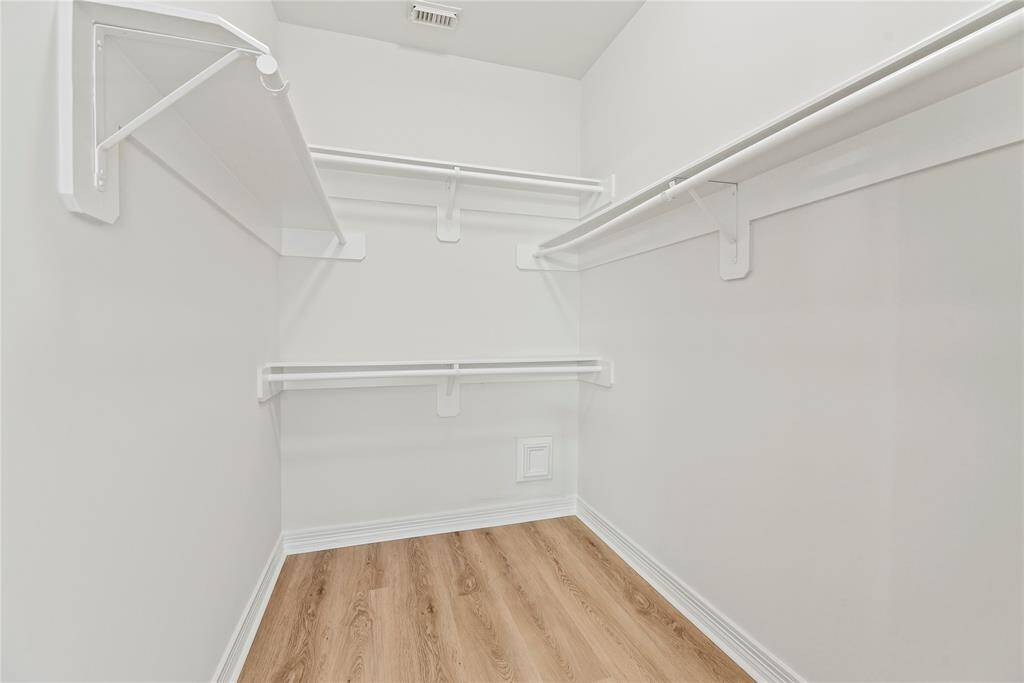 No matter how often you purchase new threads online or at the mall, this walk-in master bedroom closet has space for all your new and favorite wares!