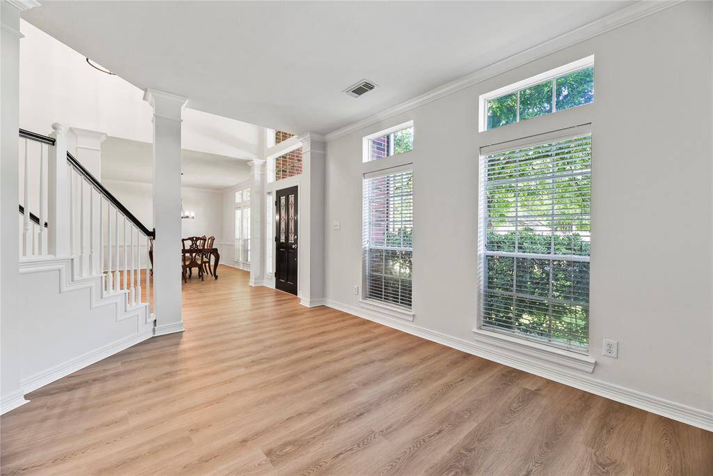 Views of the staircase and front door, this space is perfect for a variety of uses. Run a small internet business from your front office or use the space for teaching children and their schoolwork.