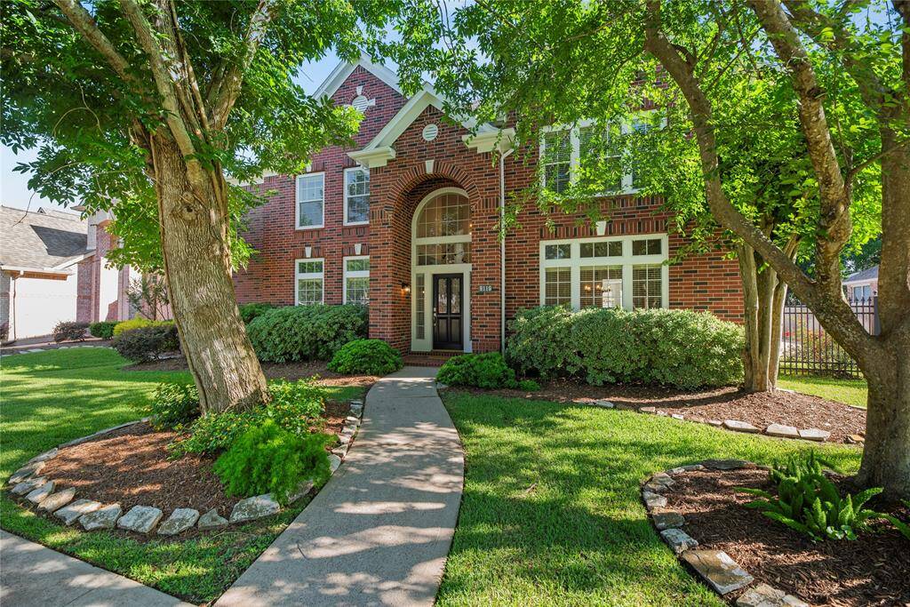 Beautifully landscaped with a mature tree, the 5BR/3BA, 3,794sqft home mesmerizes with a nearly, all-brick front exterior.