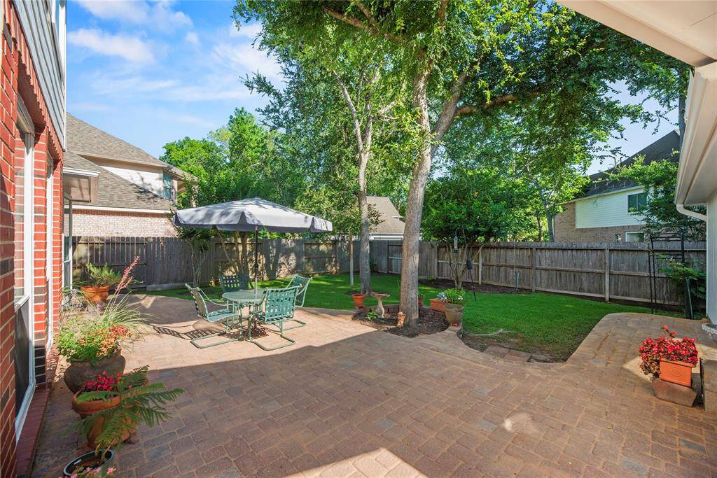 The wide patio has tons of space for al fresco dining. Chat with friends over cocktails, as the kiddos and dogs play in the fully fenced-in backyard.