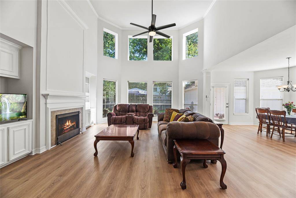 Welcoming and conveying warmth, the living room offers an inviting space for evening movies or holiday gatherings. Tune into your favorite streaming show, while admiring the cozy fireplace.