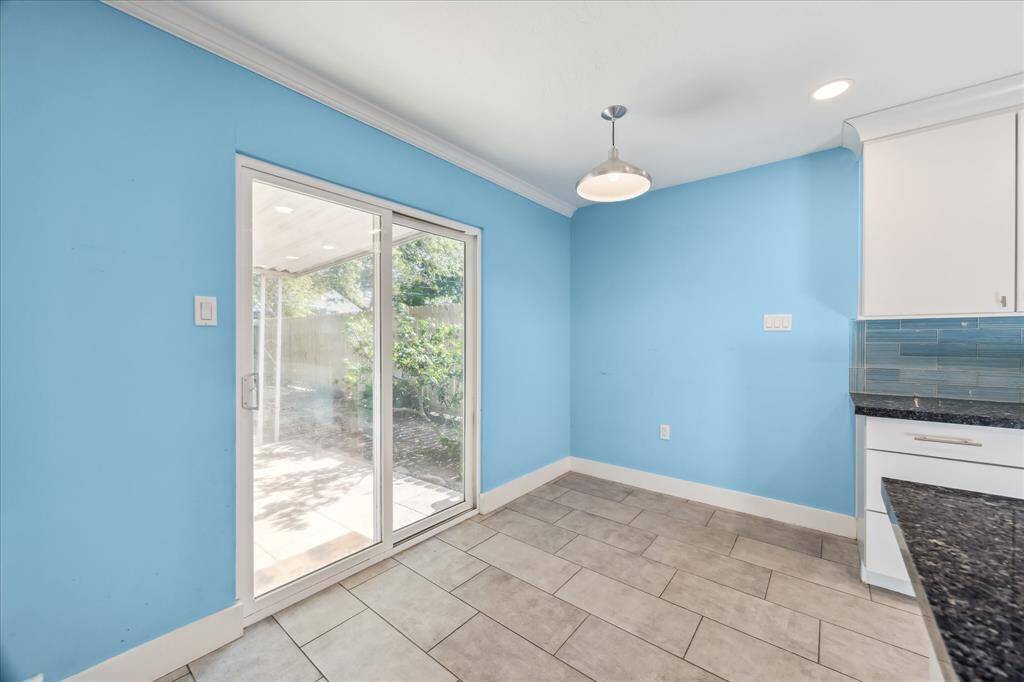 Breakfast nook leads to the covered back patio.