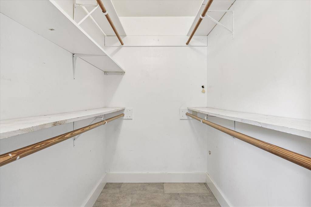 Double rack walk-in closet in the primary suite.