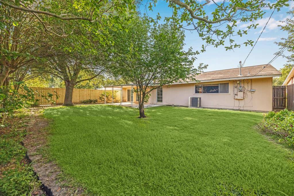 Mature trees and endless possibilities in this beautiful back yard.