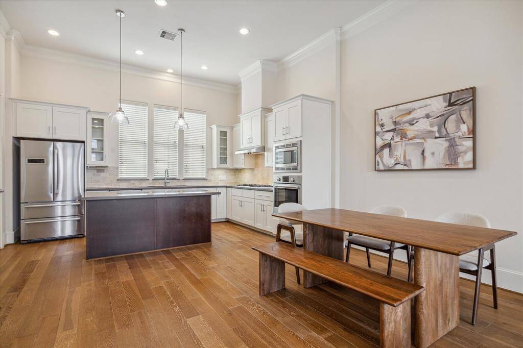 Ideal open Kitchen/Dining layout with gleaming hardwoods and soaring ceilings. Plenty of space to fit whatever sized Dining Table you like!