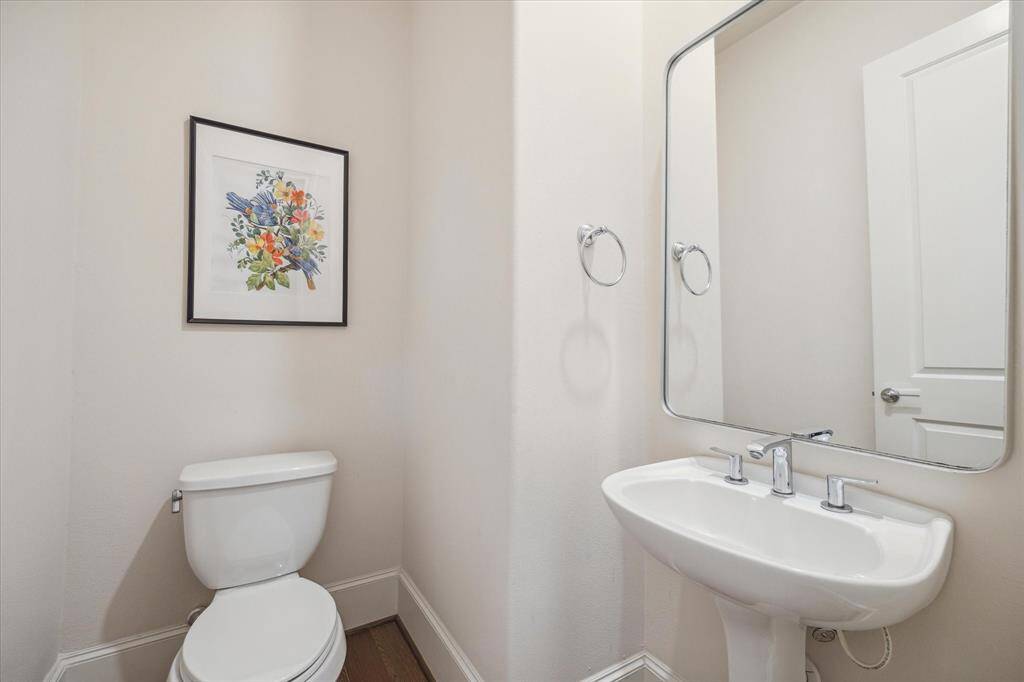 Powder Room is tucked away on the 2nd floor at the top of the stairs from the 1st floor.