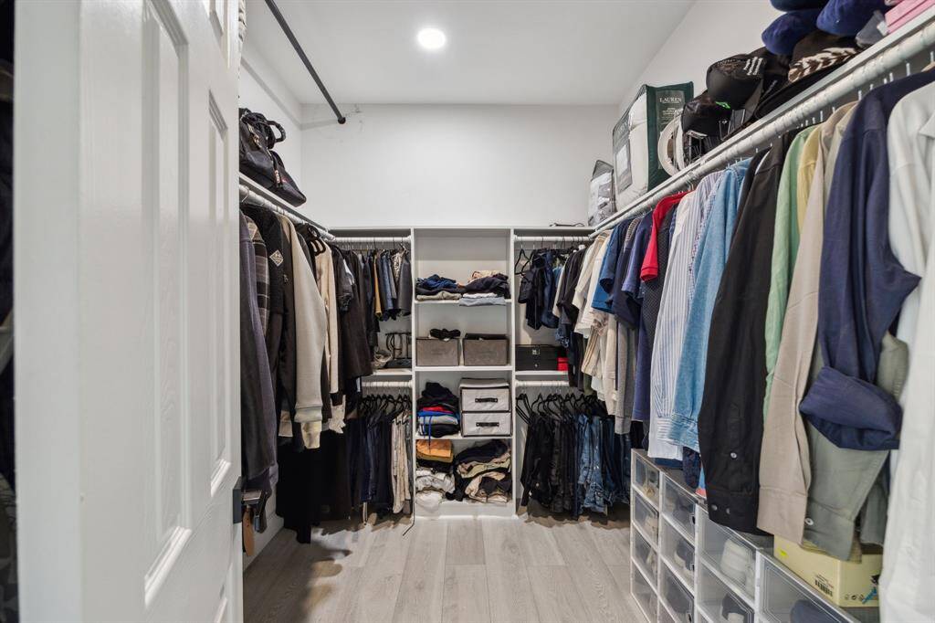 Walk-In closet features plenty of storage options.