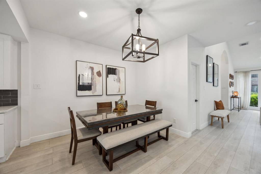 Another view of the dining room with seamless flow to the living room.