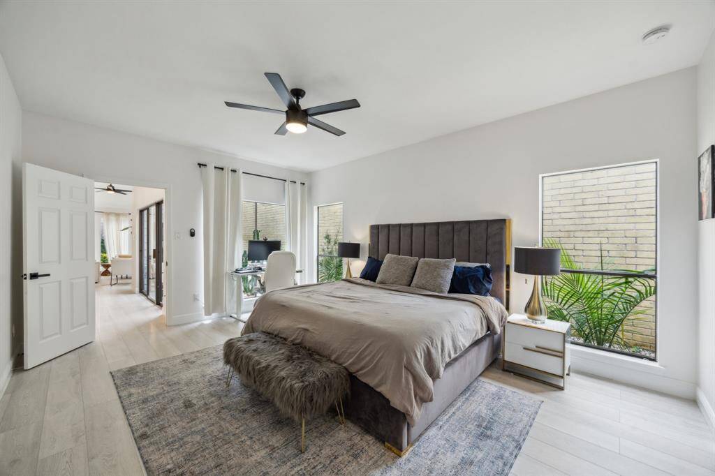 Primary suite offers beautiful views of the outdoors.