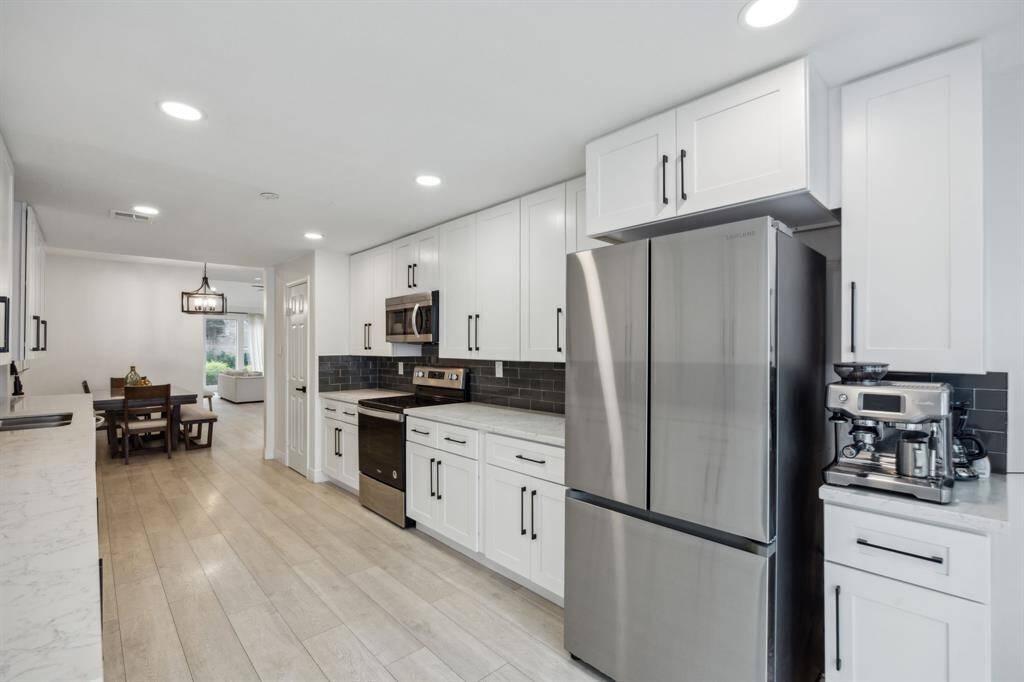 Another view of the kitchen. Note the abundance of storage and prep space.