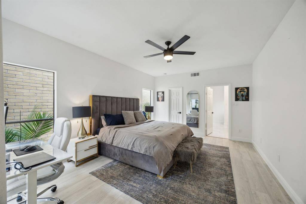 First floor primary suite boasts walk-in closet and fully upgraded bath with double sinks and vanity.