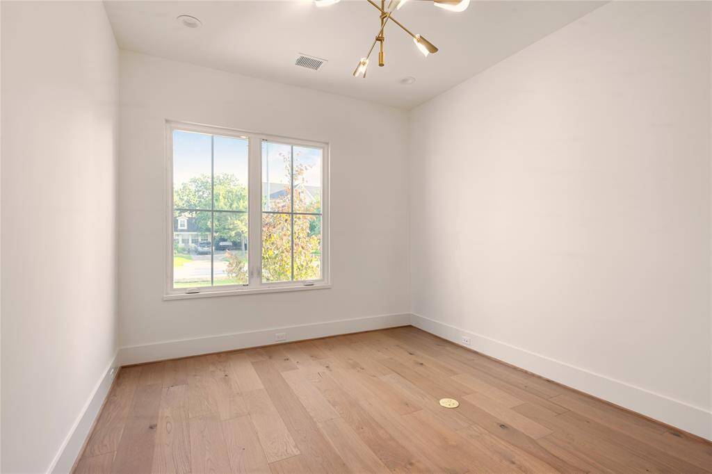 The Office / 5th bedroom looks over the beautiful front yard.
