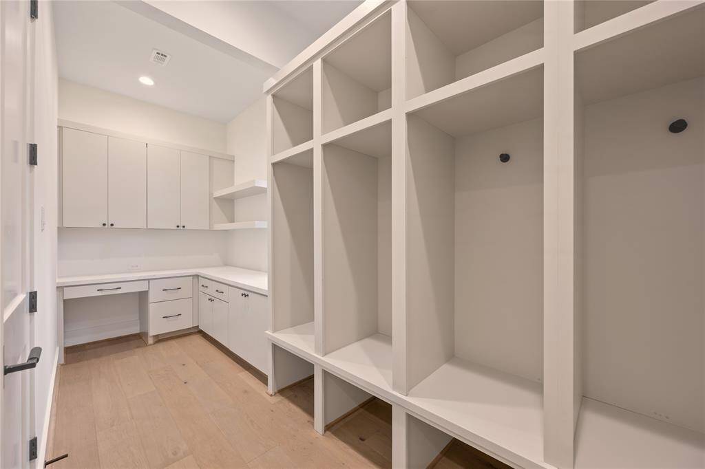Behind the stairs you will find the mudroom and tucked behind that a planning center / additional office.
