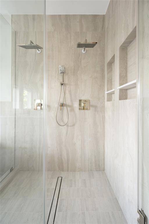 Primary shower includes two shower head system.