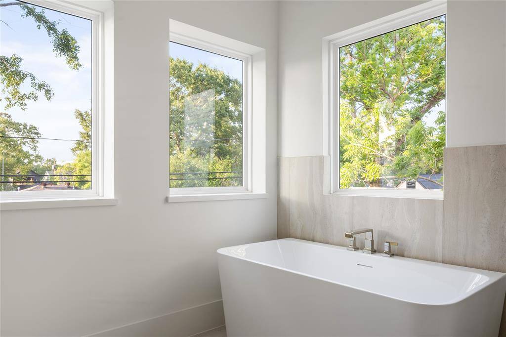 Take in a view of the trees as you relax in your freestanding tub.
