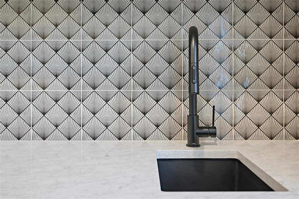 Close up of the laundry room tile and utility sink