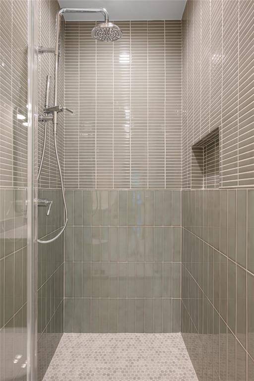 Bath 3 features a beautiful sage green shower