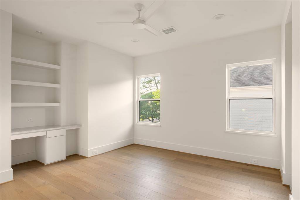 Bedrooms 2 & 3 feature a built-in desks and walk-in closets.