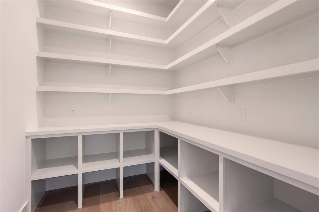 The pantry off the kitchen is large and capable of holding "Costco Runs".