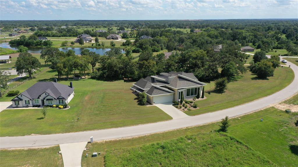 View of lot with a home on it