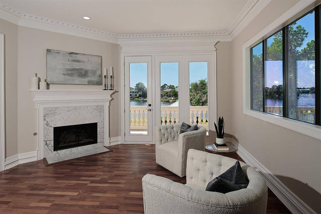 Relax by the fire or step out onto the balcony for a view of the lake