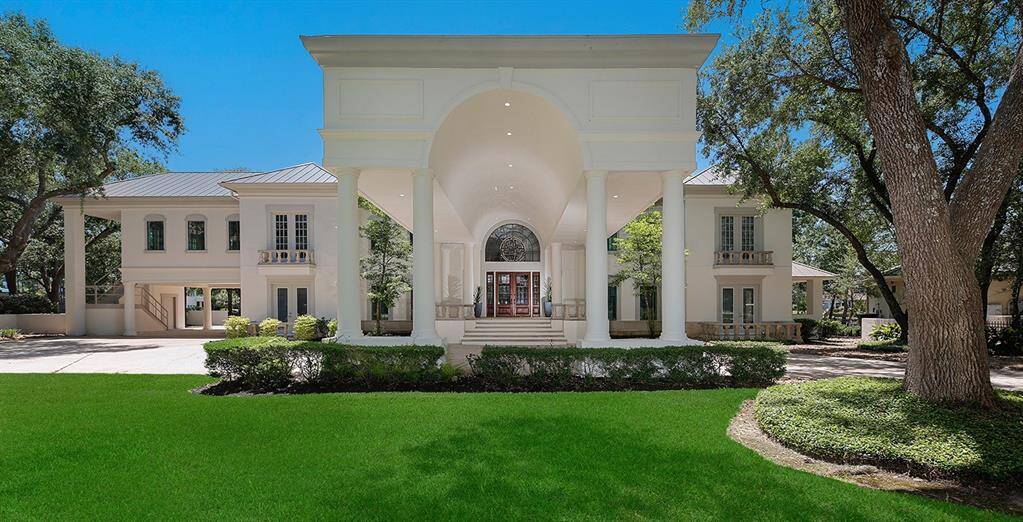 Two covered porte-cocheres and a 6 car garage