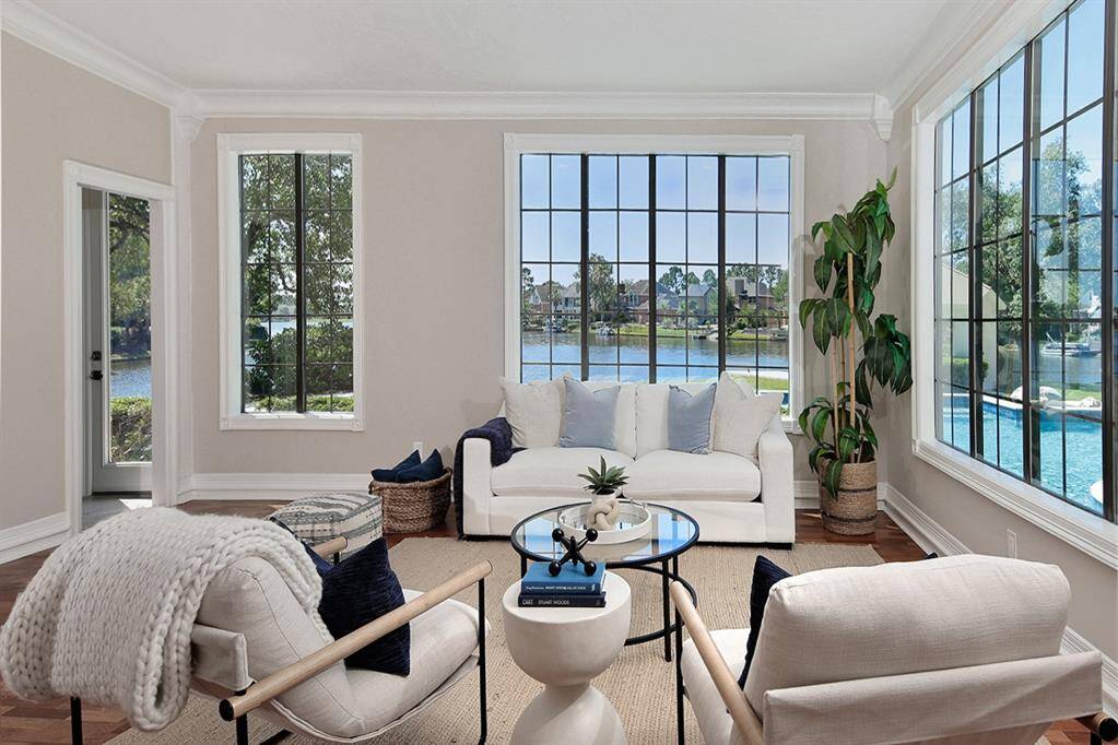 Sunroom features an indoor kitchen, pool bath & easy access to the covered patio/pool