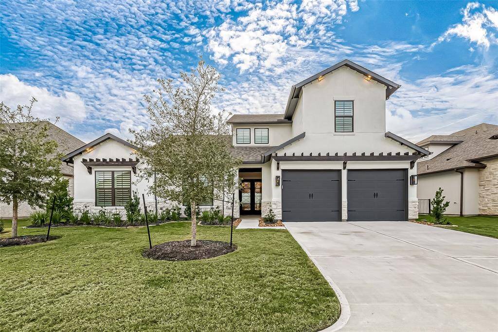 Experience the charm of Sunset Harbor with this stunning home, featuring captivating curb appeal and gas lanterns.