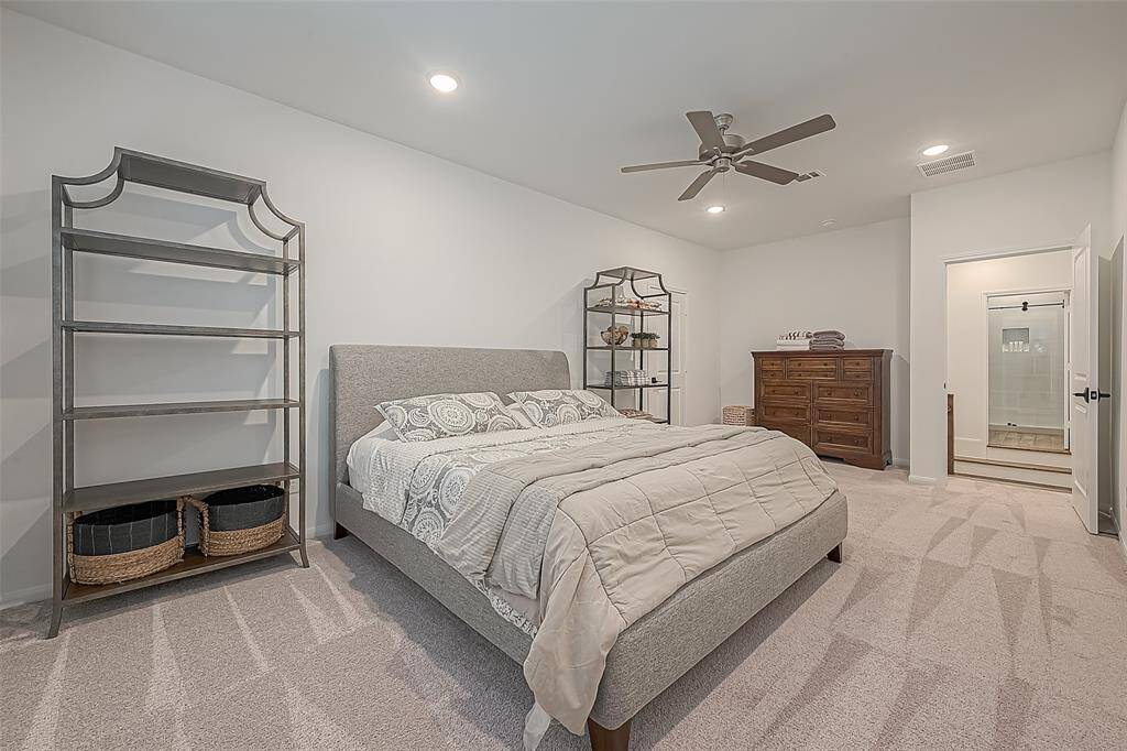 This unique upstairs bedroom offers privacy, with the other four bedrooms conveniently located downstairs.