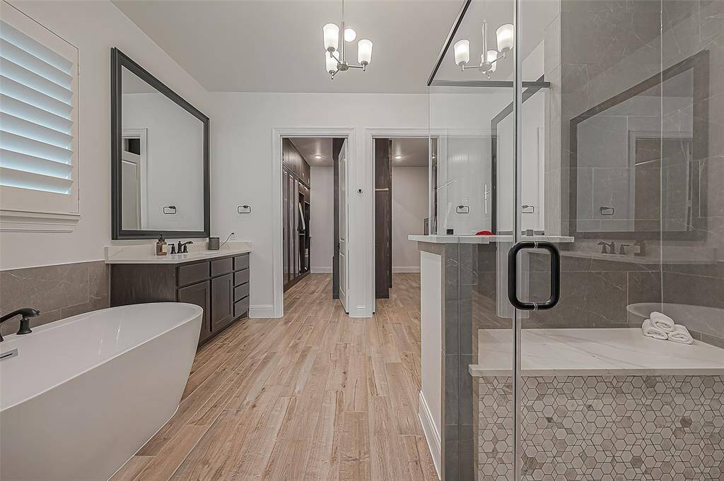 Indulge in a luxurious spa-like retreat with this elegant bathroom.