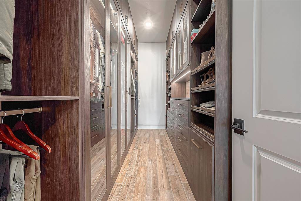 Discover the ultimate in organization with this impeccably designed custom closet, offering dedicated space for everything.