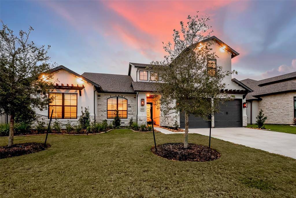 This home features elegant custom eave lighting and striking gas lanterns on the front pillars, enhancing its curb appeal.