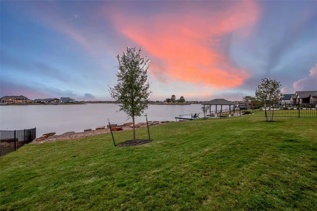 Tranquil backyard with daily stunning sunset views over the water.