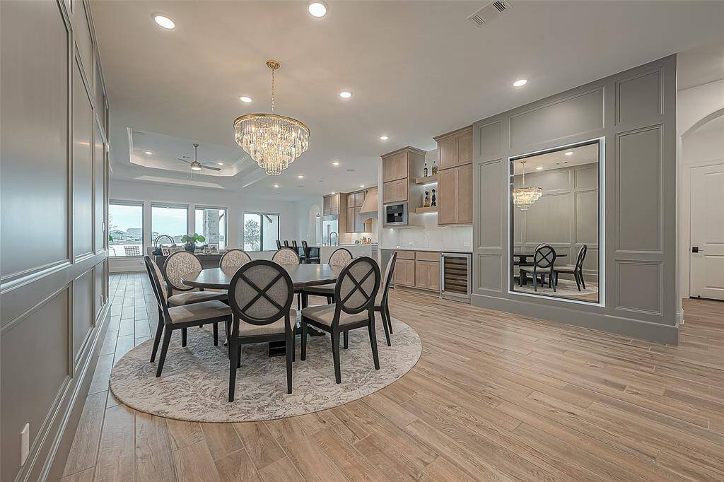 This elegant dining room was engineered to remove any obstructive columns for a open view to the water.  What an ideal way to entertain family and friends.