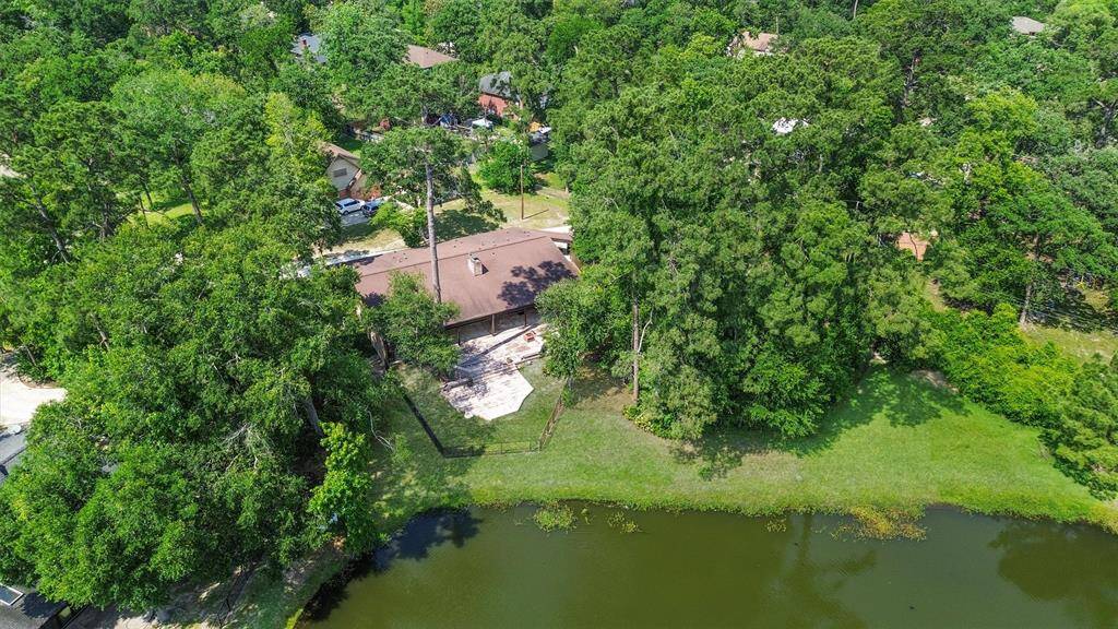 In the beautiful pocket neighborhood of Riverbrook Forest Hills, this waterfront home overlooks Little Lake, and has community access to Forest Hills Lake, playground, sports courts and more! Convenient access to College Park - 242 and I-45.