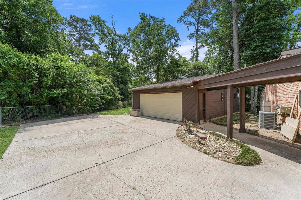 The detached Garage also houses a Studio Guest Suite with Kitchenette and Bathroom.