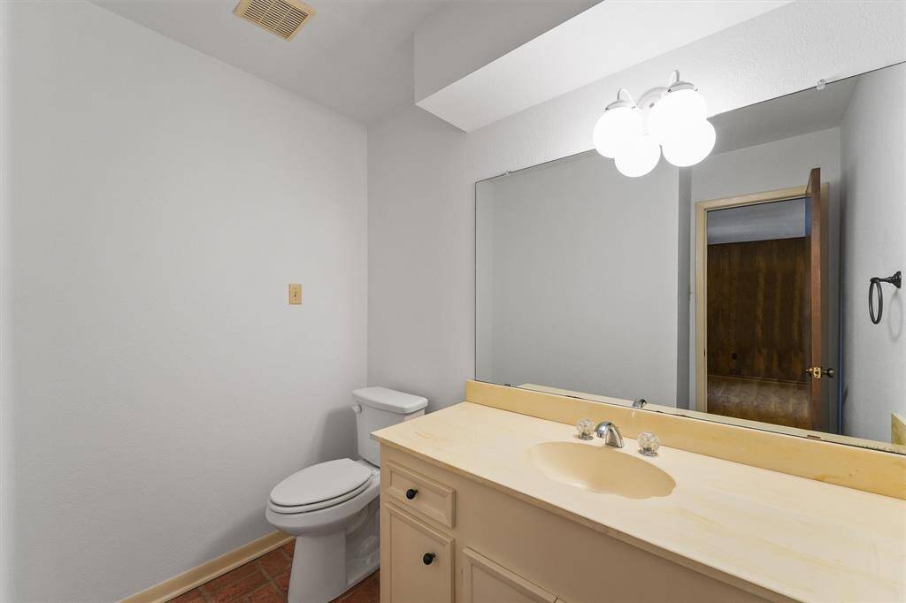 This half bath is conveniently located near the front of the home by the Flex Room and Wet Bar. Toilets and all of the plumbing in the walls were upgraded in 2019 to PEX Plumbing