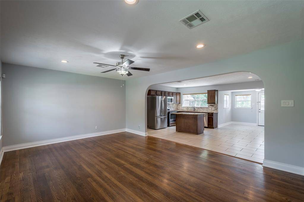 The family room measures 20x14. The wood flooring is original and has been refinished.