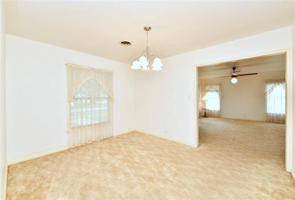 Looking from the dining room into the kitchen.