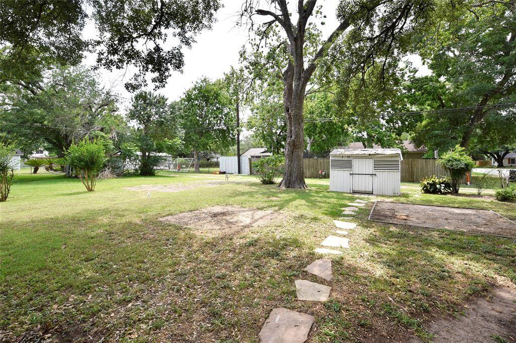 This is the side yard only the alley side. The stones lead to a picnic area and to the storage shed.