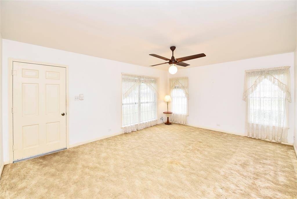 This is a view of the living room. Under that carpet are original OAK floors!