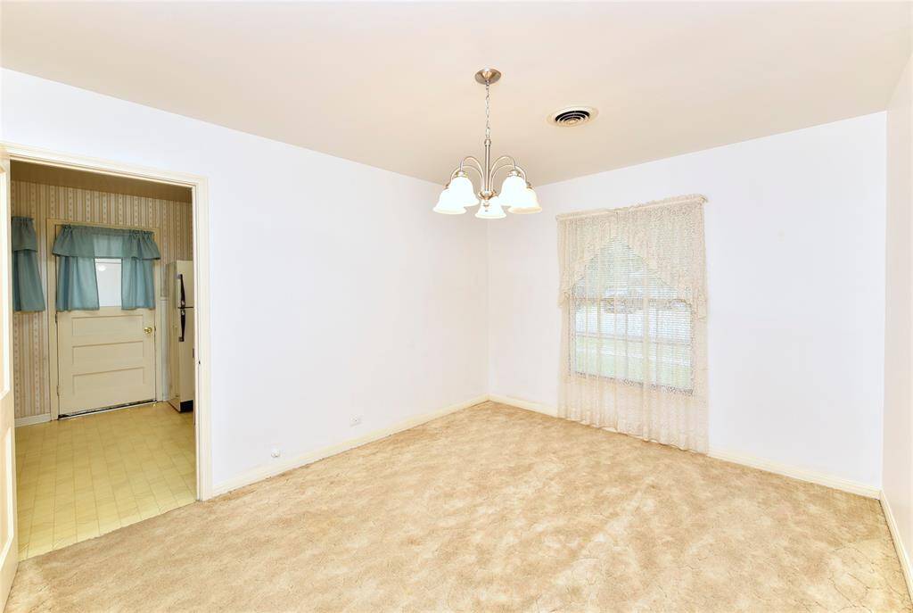 View from the dining room into the kitchen.
