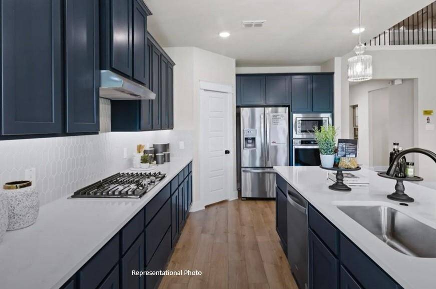 Step into a kitchen that feels like a warm embrace, where modern elegance meets the heart of home.