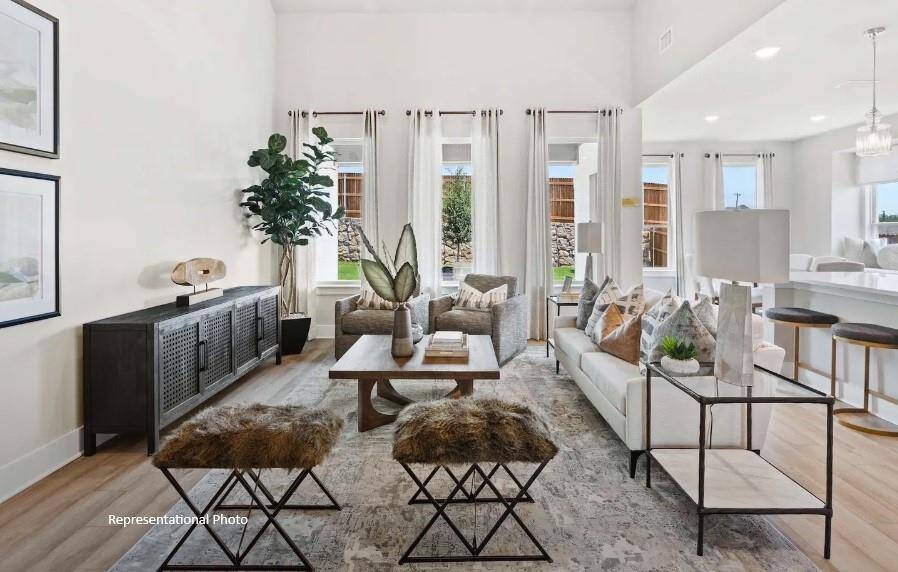 As you wander through the open floor plan, you’ll notice high ceilings that elevate the ambiance, while carefully chosen materials add a touch of luxury without losing that cozy feel.