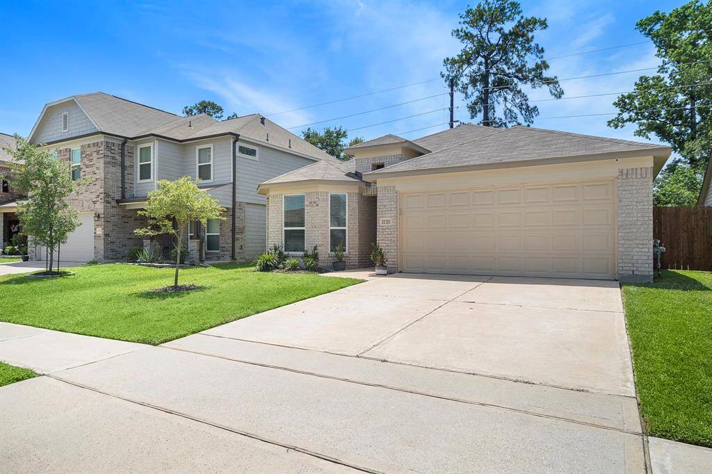 The neighborhood appears calm and inviting, with mature trees and neat landscaping.