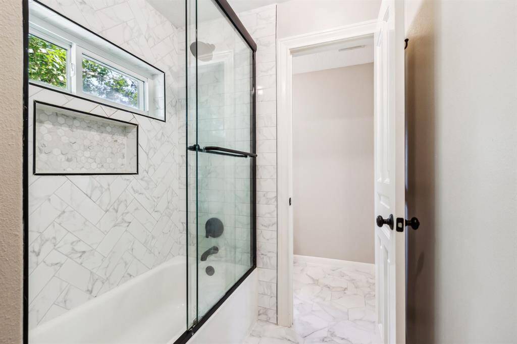 Shower/tub combo in Hollywood bath.