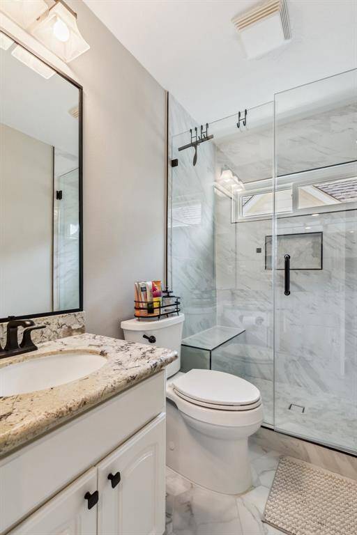 Upstairs full bath featuring walk in shower.